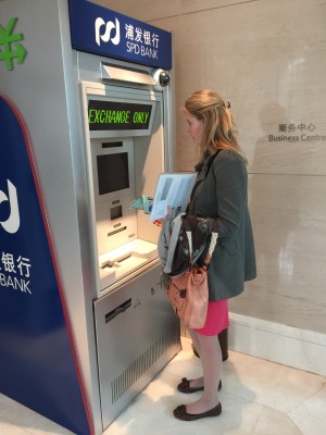 Lindsay Wagner, EMBA 43, getting RMB from the cash machine outside the hotel lobby. 