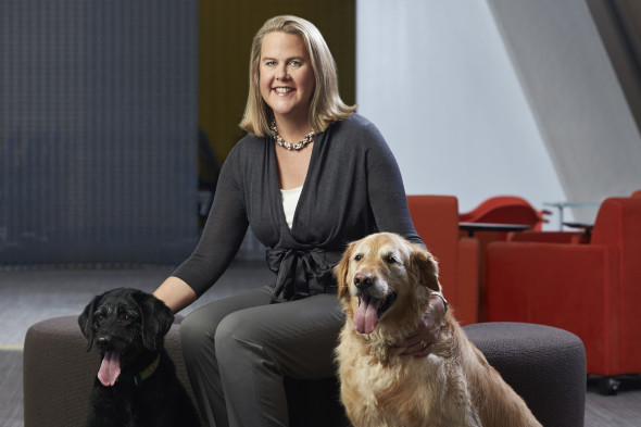 Nina Leigh Krueger with her canine family at Nestle Purina Petcare. (Photo © Whitney Curtis)