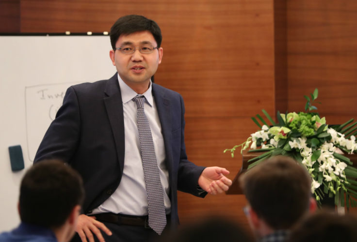 Fuqiang Zhang teaching a global operations class to second-year MBA students in March 2019, during Olin