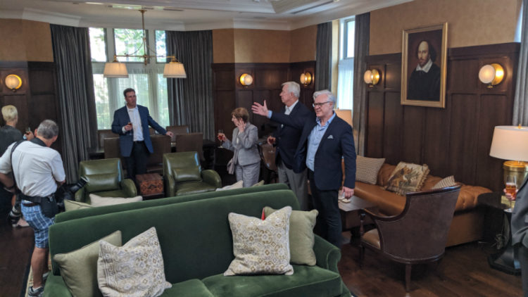 Visitors, welcomed by Dean Mark P. Taylor, break in the new Bear Public House at the dedication on October 2, 2019.
