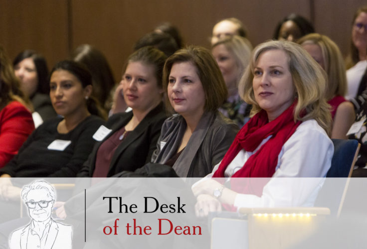 Attendees watching the panel discussion at WashU Olin