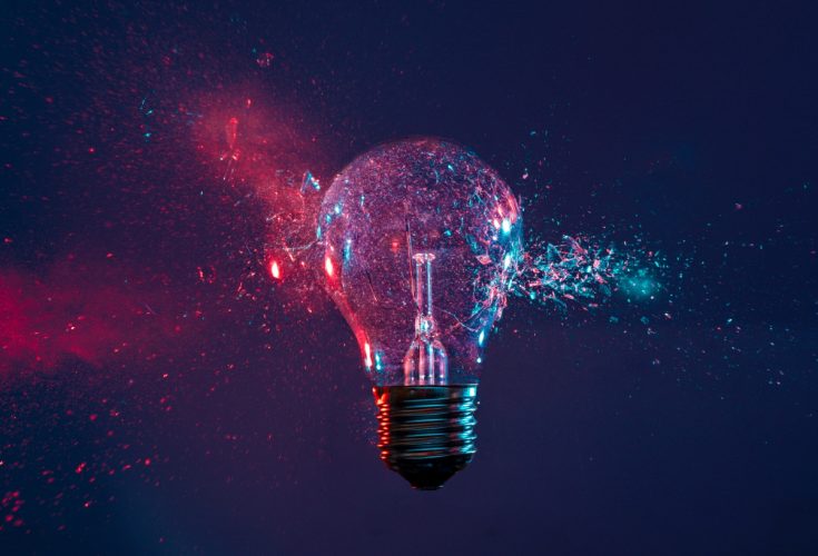 Multicolored image of a lightbulb bursting as an iconic representation of digital innovation.