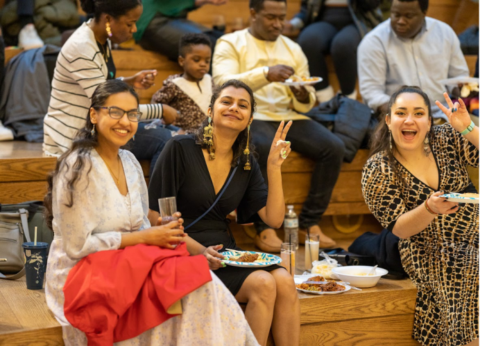 Classmates and friends of OABC enjoying spicy African food during the 2023 Taste of Africa event, in anticipation of the much-awaited fashion show.