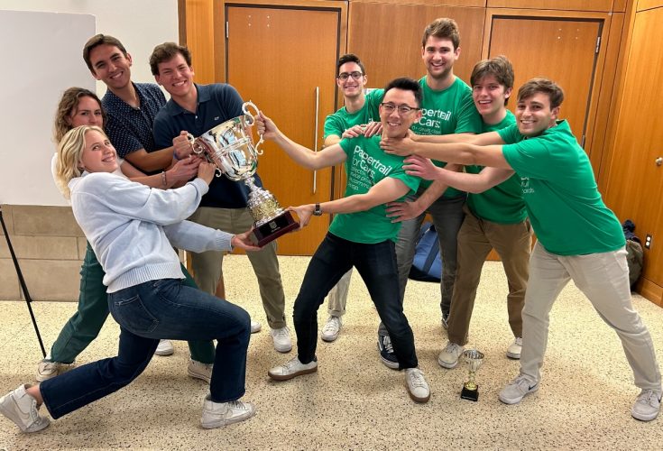 Pictured at top: The Olin Cup winning teams—Find It, left, and Papertrail, right—wrestle over the prize after tying in the competition on April 18.