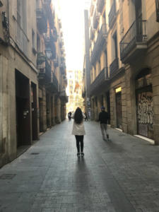 Farah Qureshi, MBA '19, pauses to take a photo of Spanish architecture during the iPad excursion in Barcelona.